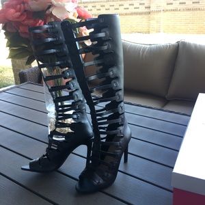 Beautiful knee high-heeled sandals. Never worn.